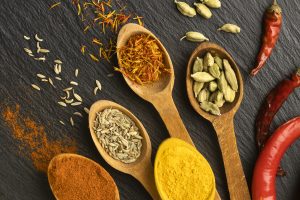 top-view-indian-spices-with-wooden-spoons (1)